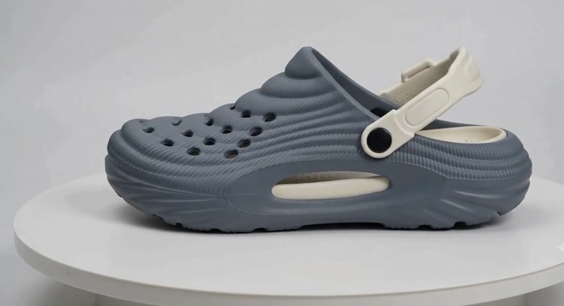 Side profile of a Slideez EVA clog showing the moulded upper, vent openings, back strap and sole.